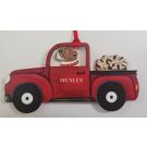 RED TRUCK WITH BUSHEL OF BONES