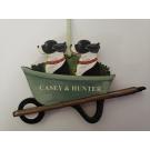 GREEN VINTAGE WHEELBARROW. 2 DOGS