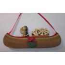 Holiday Canoe Dog On The Move ornament with Bushel of Bones